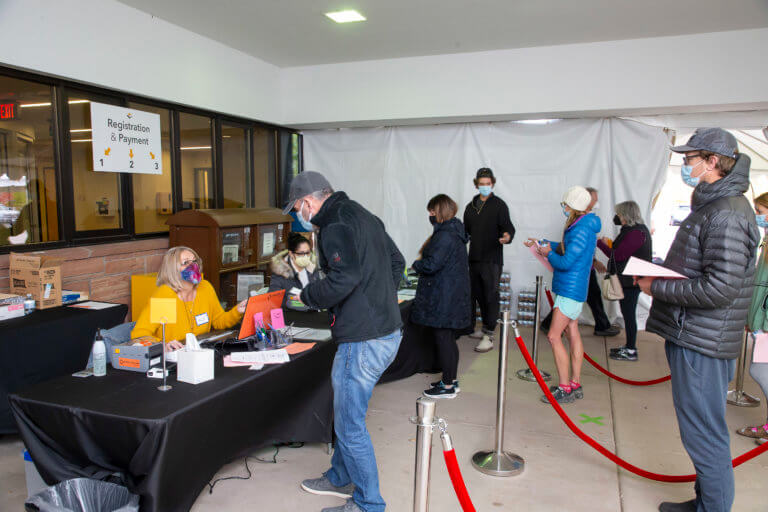 Community members lined up outside for the health fair