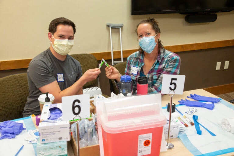 Volunteers welcoming attendees at the registration table
