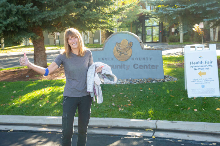 Woman giving thumbs up outside the health fair