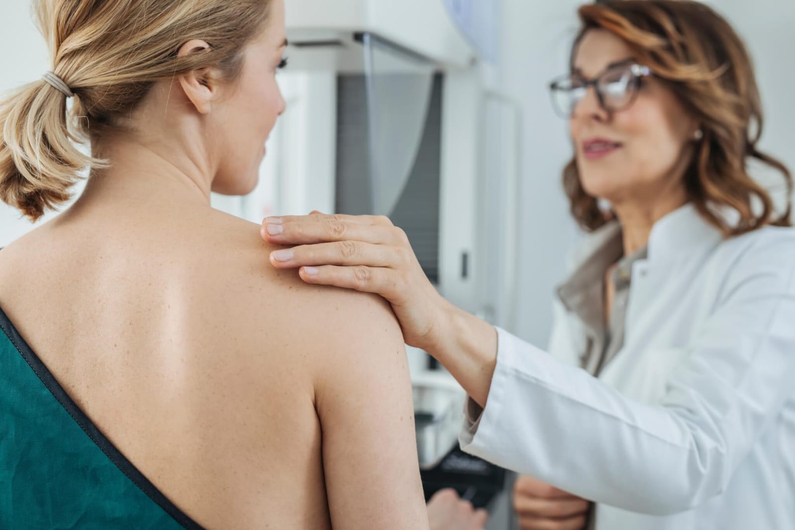 woman in the process of early detection of breast cancer through getting a mammogram