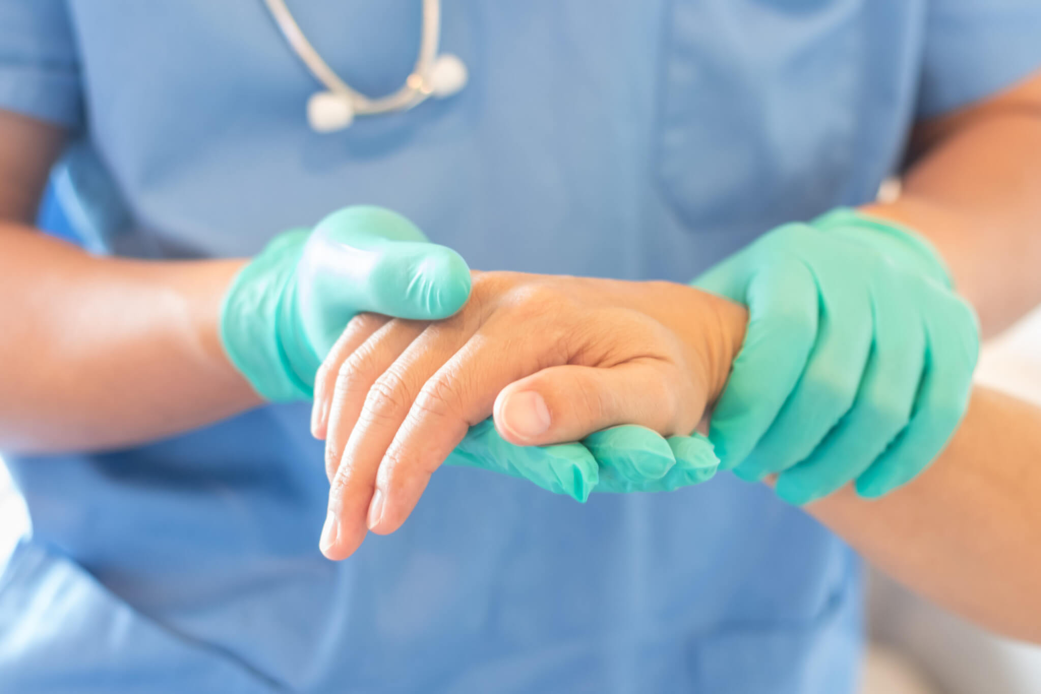 Surgeon holding patients hand