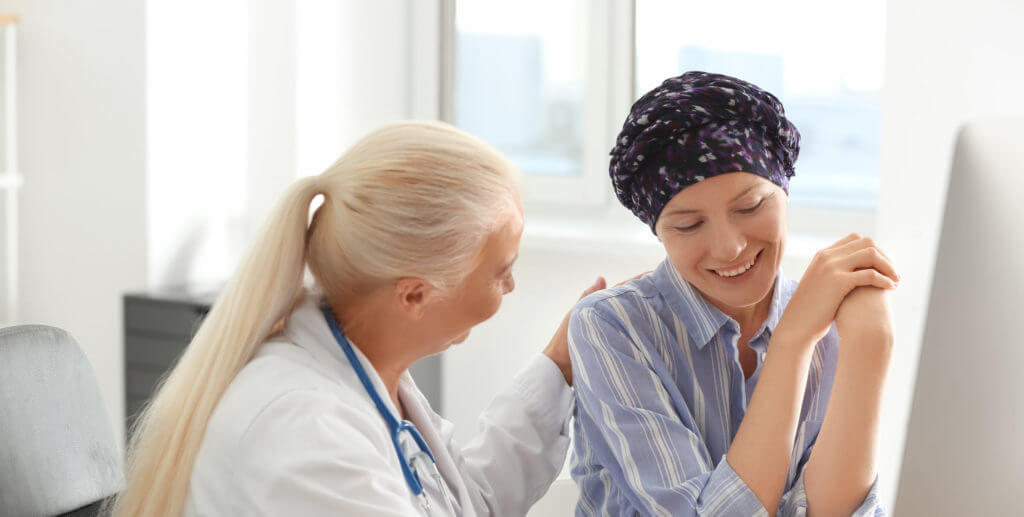 Woman after chemotherapy visiting doctor in hospital - most common types of cancer featured image
