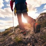 rear view person hiking during sunrise