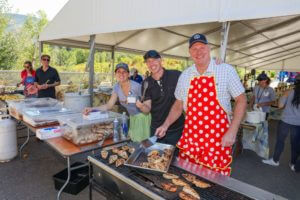 people grilling chicken