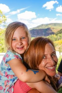 woman and child smiling for photo