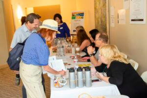 event staff assisting attendee