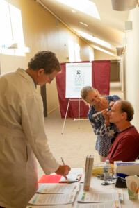 medical staff performing eye exam