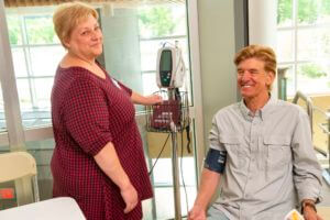 nurse taking vital with machine for patient