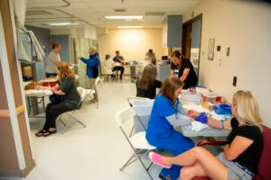 nurses drawing blood from patients