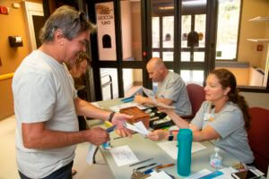 man checking in at health fair