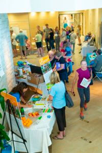 attendees walking through health fair