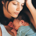 Mother resting with child