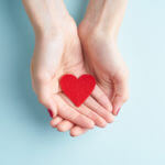 Hands holding a red heart