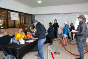 group standing in line outside for health fair