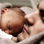 closeup of dad holding baby