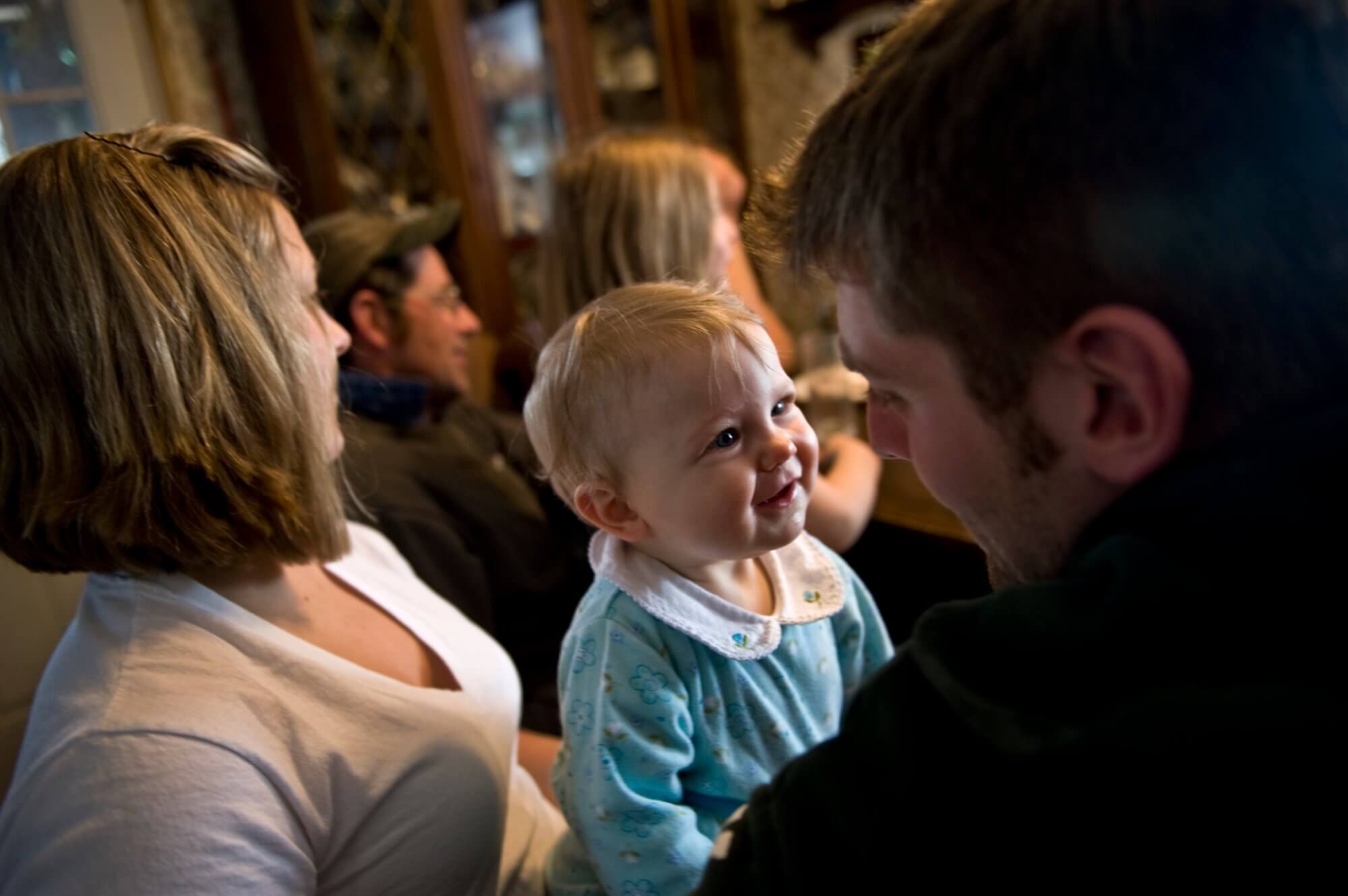 Parents holding smiling child