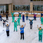 Nurse team posing outside emergency center