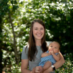 Mother holding baby outside