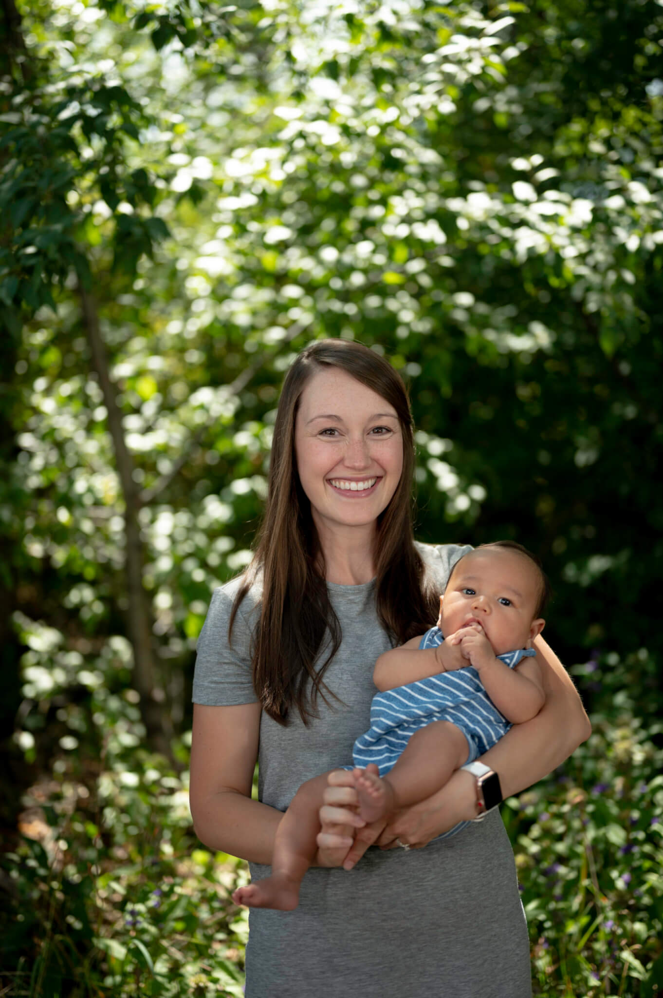 Mother holding baby outside