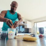 athlete making a protein shake