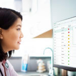 Doctor examining xray on computer