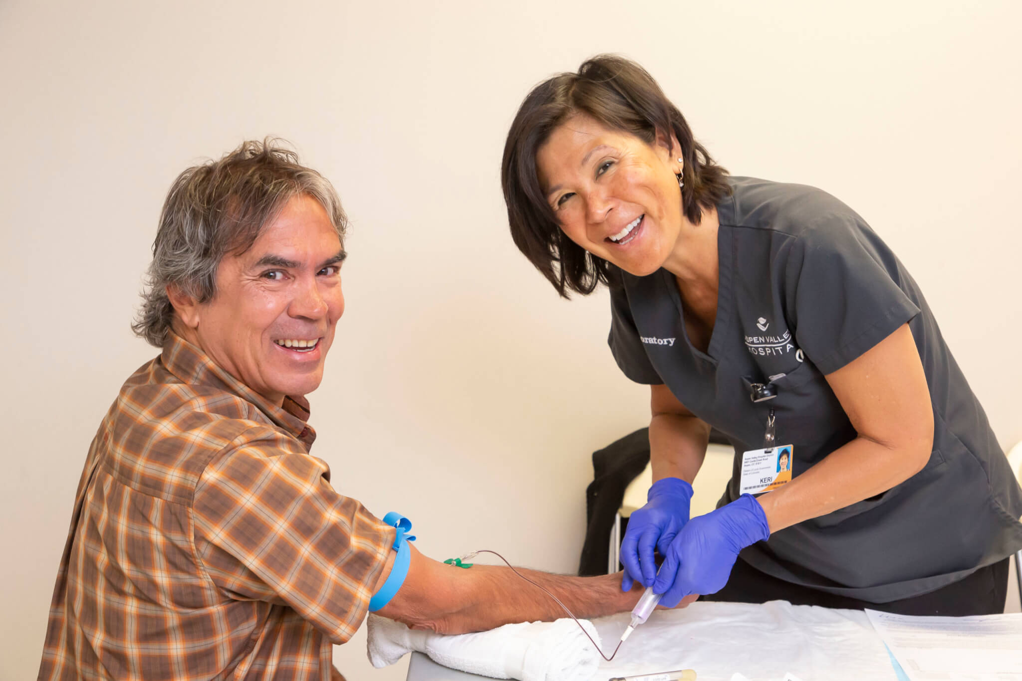 Man getting blood work from nurse