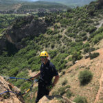 Climber on side of cliff