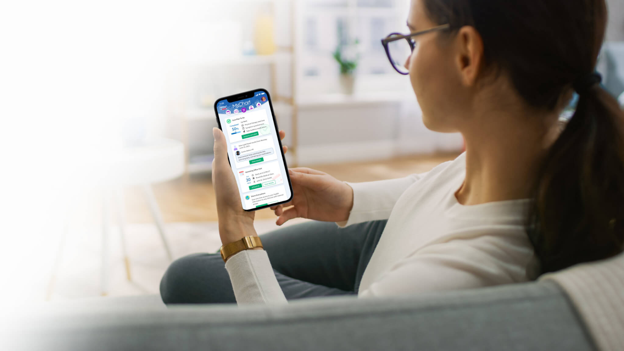 Woman using phone on couch