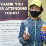 senior woman holding snacks and vitamins