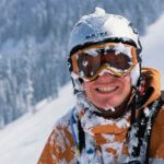 Skier covered in snow