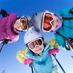 Happy family skiing together