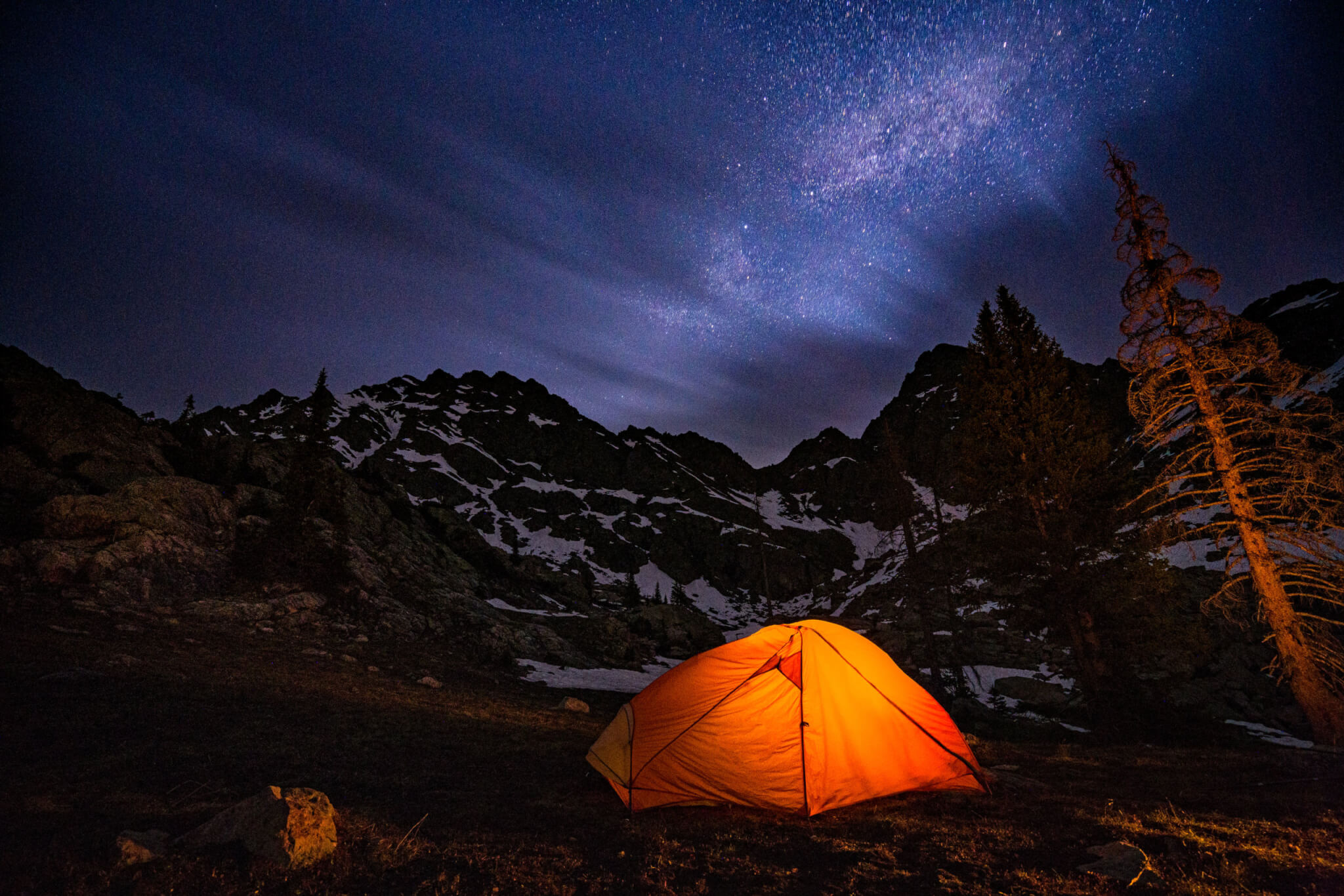 glowy tent under the stars at night