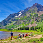 hikers taking a break with mountains in distance