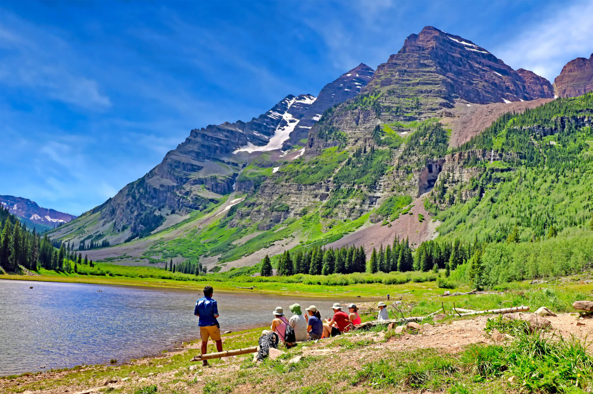 hikers taking a break with mountains in distance