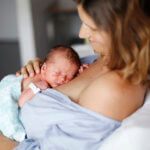 mother and newborn at maternity ward