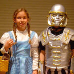 people dressed as tin man and dorothy from wizard of oz