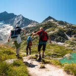 family with child hiking on holiday in austrian alps