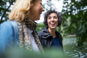 Two women laughing as close friends