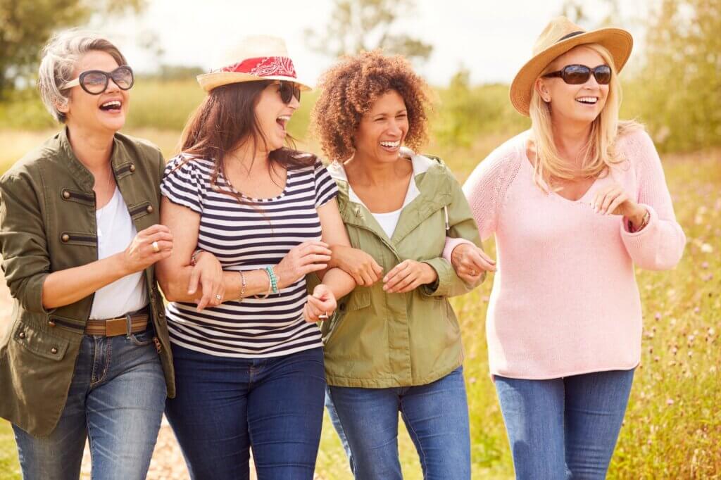 Group Of Mature Female Friends Walking Along Path caring for women’s hormones