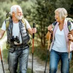 senior couple hiking in forest