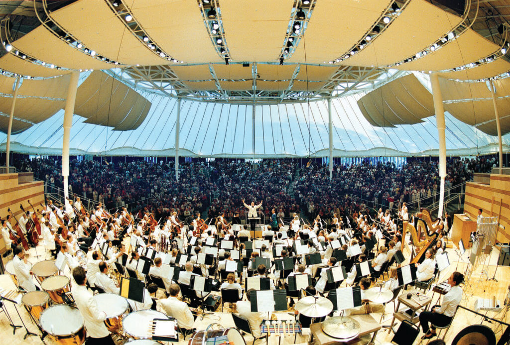 wide angle lens the view of an orchestra from the back Conductor David Zinman recieves a standing ovation as he and the Aspen Music Festival orchestra complete a splendid rendition of Verdi's "Aida". Dan Bayer photo.