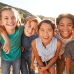 Portrait Of Multi-Cultural Children Hanging Out With Friends In Countryside Together autism and social skills