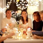 the greatest gift is love family with sparklers having tea party at home