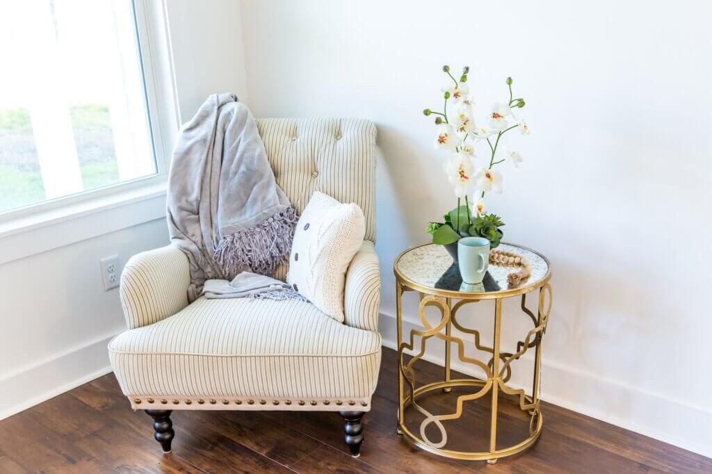 Reading nook corner with an armchair of a new construction house with hardwood floors