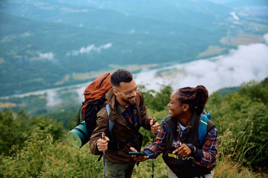 couple going on a hike in the mountains to reduce their risk of high cholesterol