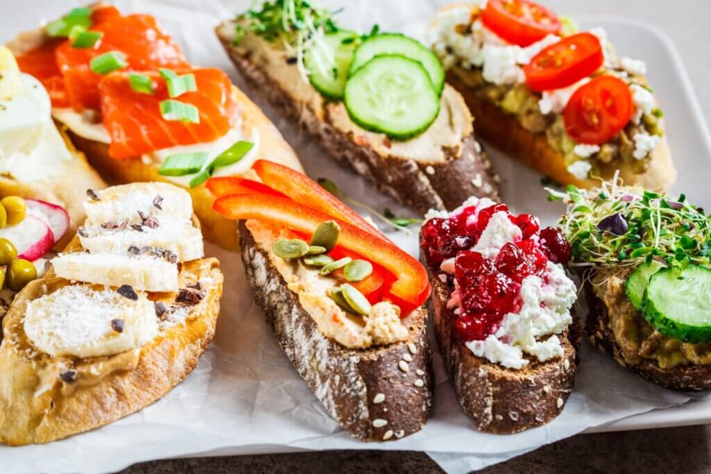brain gut connection health promoting foods like red peppers and cucumbers on thick slices of whole grain bread