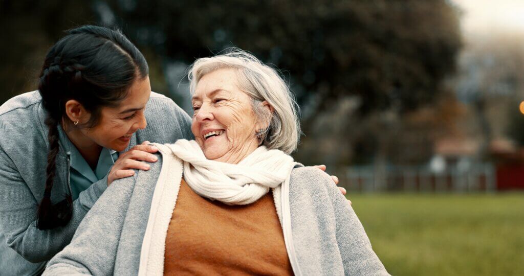 a woman using validation based communication dementia caregiver tips to help improve the mood of an elderly woman with memory loss 