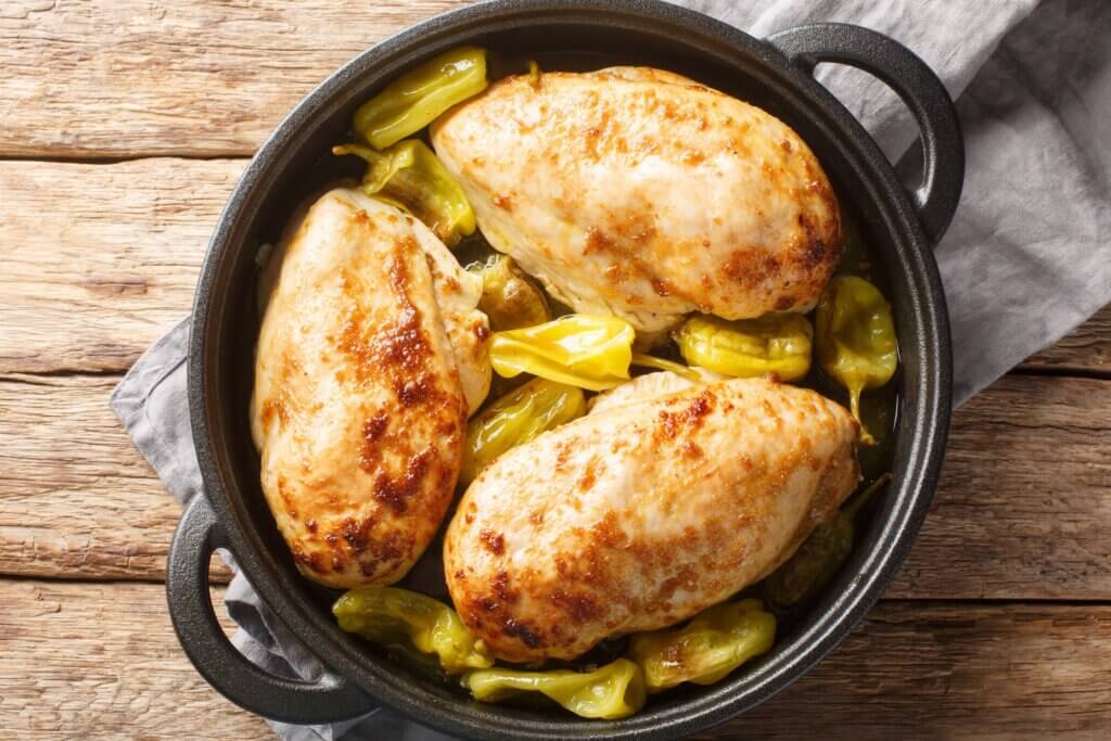 slow cooker chicken recipe for diabetes featuring banana peppers sprinkled amongst the lean chicken breast