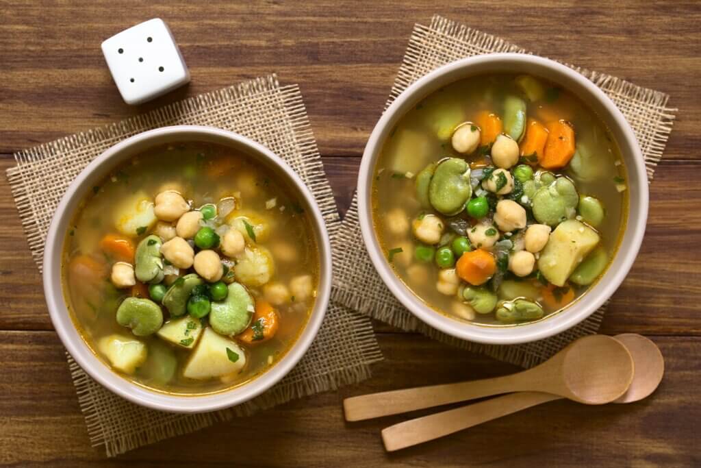 two bowls of a vegetarian diabetic crock pot cooking recipe with beans and veggies soaking in a warm vegetable based broth