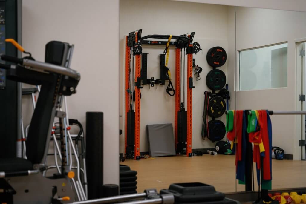 exercise bands and weight plates in a sports medicine and rehabilitation facility